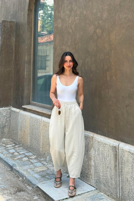 PANTALLONA TE GJERA NJE NGJYRESHE PER FEMRA NE NGJYRE KREM - KLAUDIO FASHION