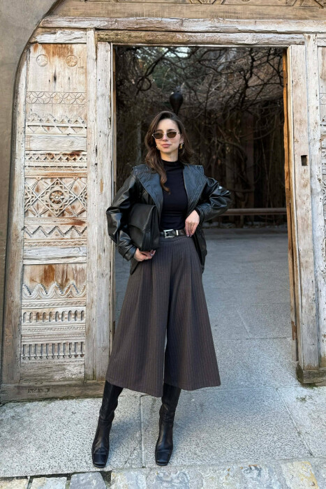 XHAKETË NJË NGJYRËSHE LËKURE ME BEL ELASTIK PËR FEMRA NË NGJYRË TË ZEZË - KLAUDIO FASHION