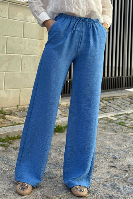 PANTALLONA ME BEL ELASTIK DHE ME DETAJIN E LIDHSEVE PER FEMRA NE NGJYRE BLU TE ZBARDHUR - 4