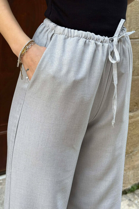 PANTALLONA ME BEL ELASTIK DHE ME DETAJIN E LIDHSEVE PER FEMRA NE NGJYRE GRI GRI - 4