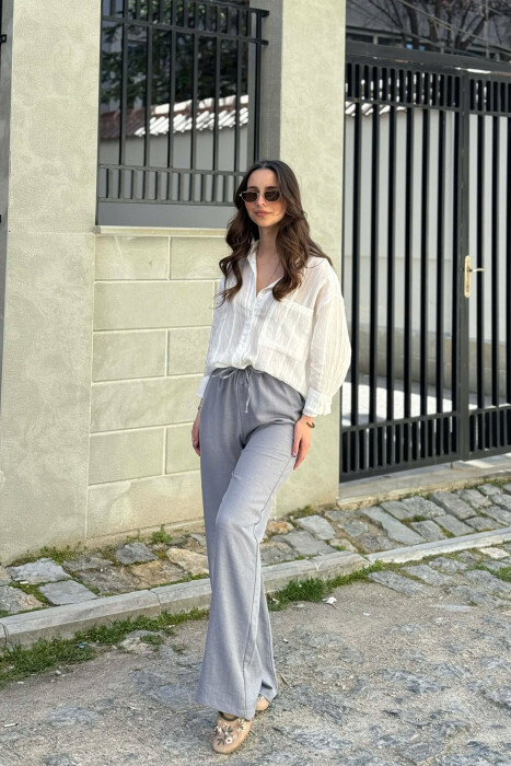 PANTALLONA ME BEL ELASTIK DHE ME DETAJIN E LIDHSEVE PER FEMRA NE NGJYRE GRI HIRI - 7