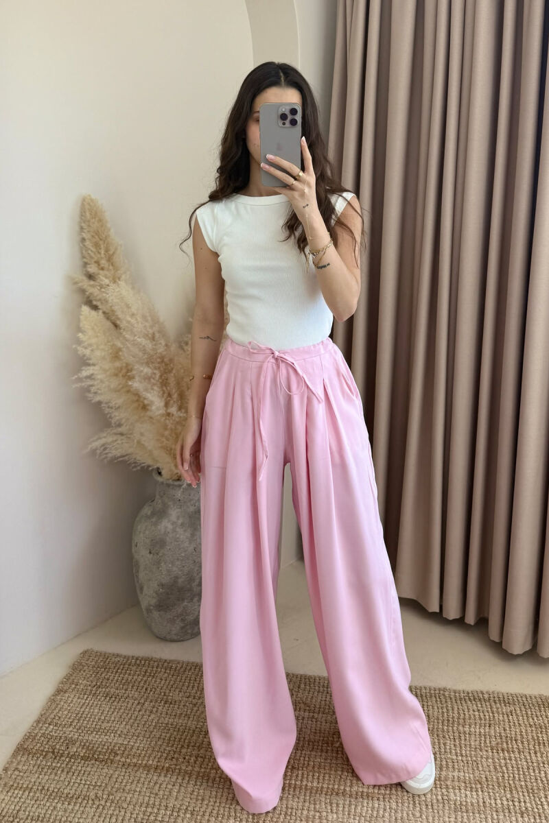 PANTALLONA ME DETAJIN E LIDHSES ME BEL GJYSMË ELASTIK PËR FEMRA NË NGJYRËN BABY PINK - 1