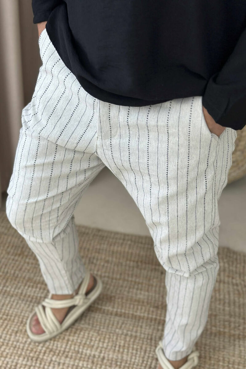 PANTALLONA ME DETAJIN E VIJAVE PËR MESHKUJ NË NGJYRËN BEZHË E ZBARDHUR - 2