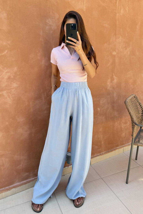 PANTALLONA NJË NGJYRËSHE TË THJESHTA PËR FEMRA NË NGJYRËN BABY BLUE - 2