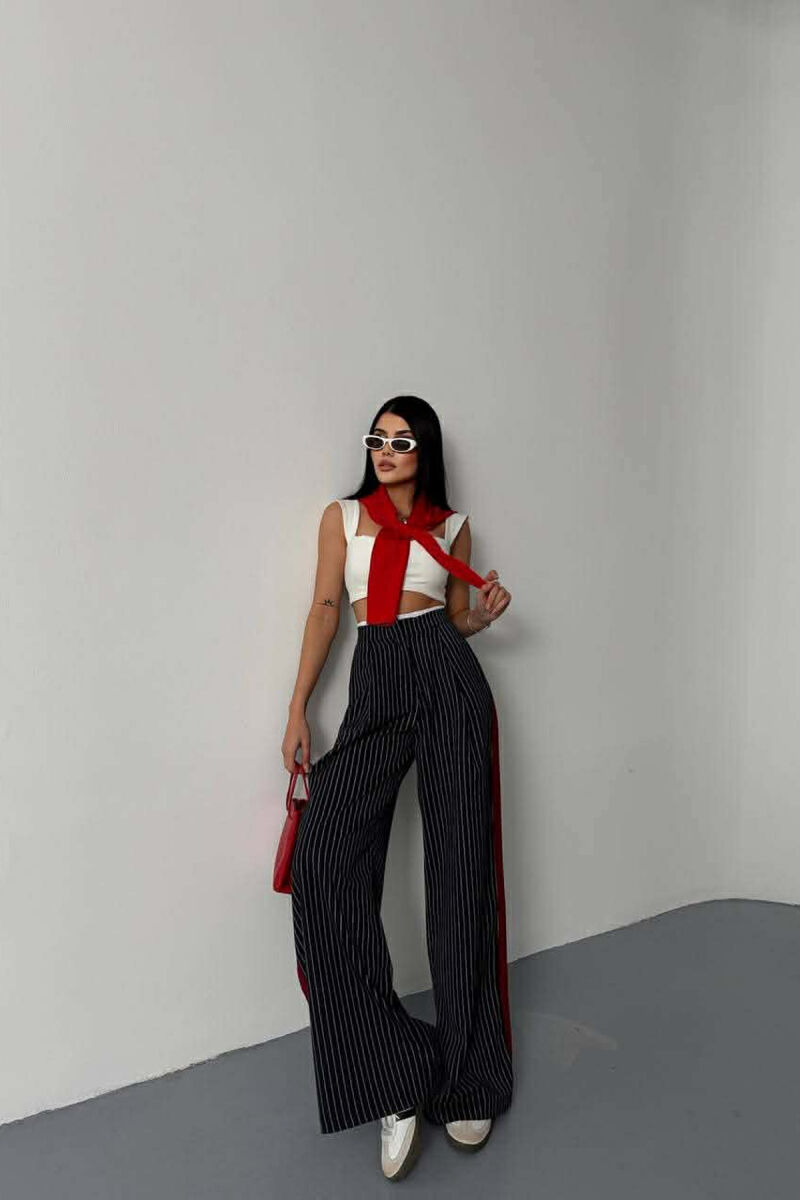 PANTALLONA TE GJERA NJE NGJYRESHE ME DIZAJN ME VIJA PER FEMRA NE NGJYRE BLU TE ERRET - 1