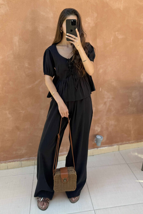 SET NJË NGJYRËSH ME DETAJIN E LIDHSES T-SHIRT+PANTALLONA PËR FEMRA NË NGJYRËN E ZEZË - 1