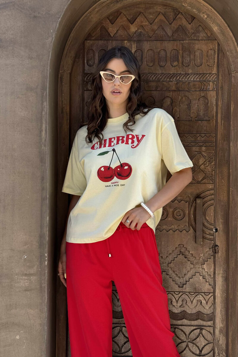 T-SHIRT ME IMAZHIN E QERSHISË PËR FEMRA NË NGJYRËN E VERDHË - 1