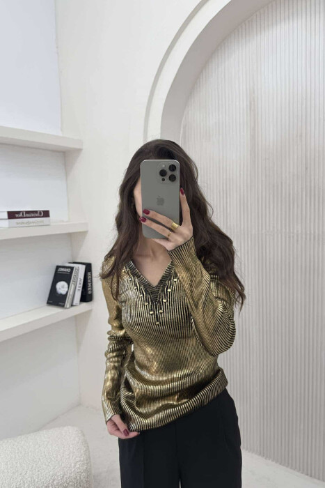 TRIKO E SHNDRITSHME PËR FEMRA NË NGJYRËN GOLD - 1