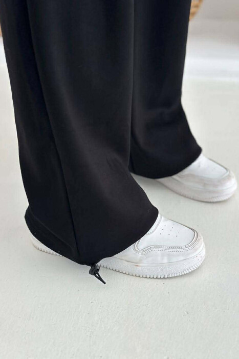 TUTA ME BEL ELASTIK DHE ME DETAJIN E LIDHSEVE PER FEMRA NE NGJYRE TE ZEZE - 5