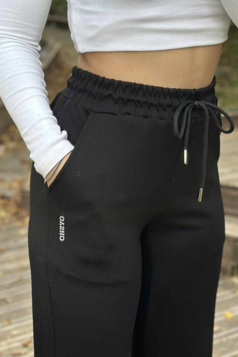 TUTA TË THJESHTA ME BEL ELASTIK PËR FEMRA NË NGJYRË TË ZEZË - 5