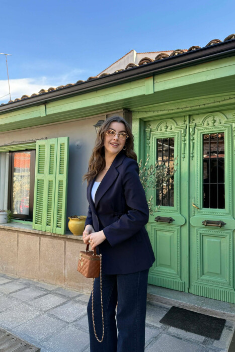 XHAKETE NJE NGJYRESHE ME BUTONA PER FEMRA NE NGJYRE BLU TE ERRET - 4